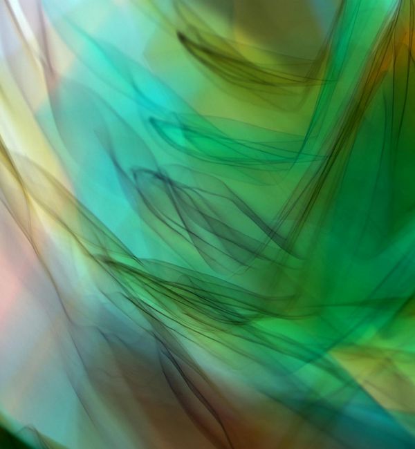 Abstract representation of flowing energy with green lines.